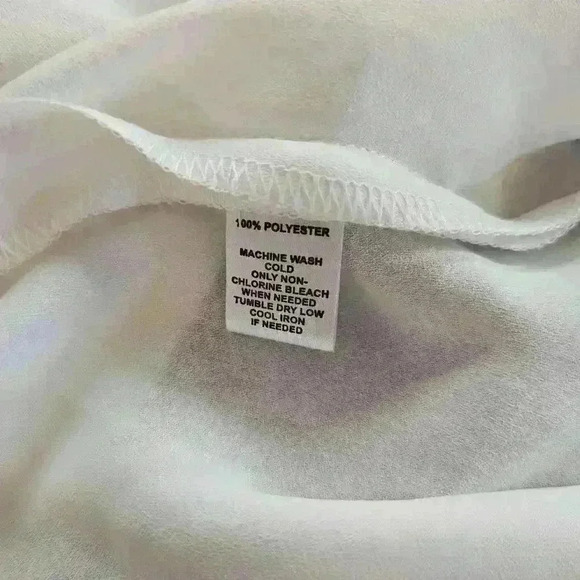 Chic Black and White Sleeveless Top with Pleated Bodice - Picture 3 of 3